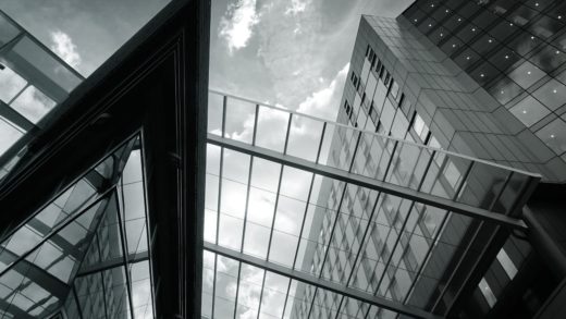 grayscale of glass building